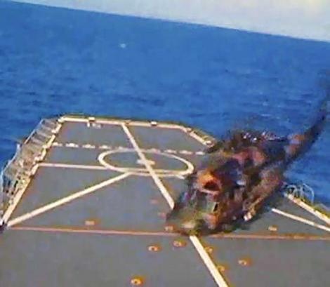 Point of impact … the Black Hawk hits the Kanimbla's deck.